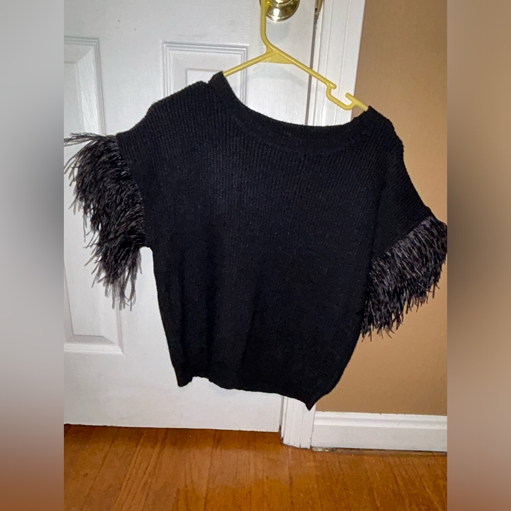 Black knitted top with feather sleeves